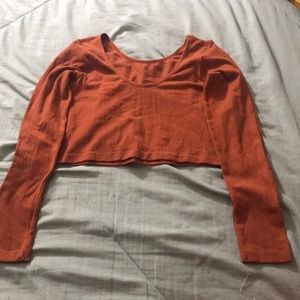 A orangy colored shirt one size.
